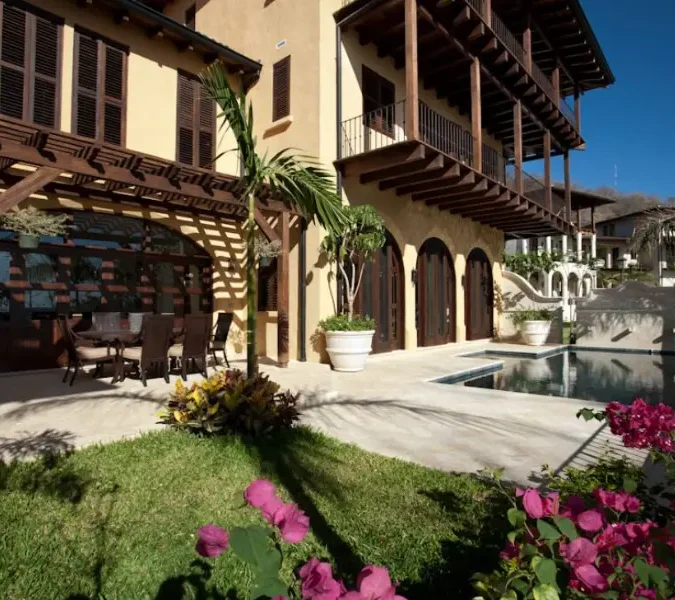 Courtyard-Style Villa with Infinity Pool, Lush Gardens & Breezy Wraparound Porches from VILLAWAY®
